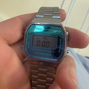 Casio Silver Digital Watch with Teal-Blue Face